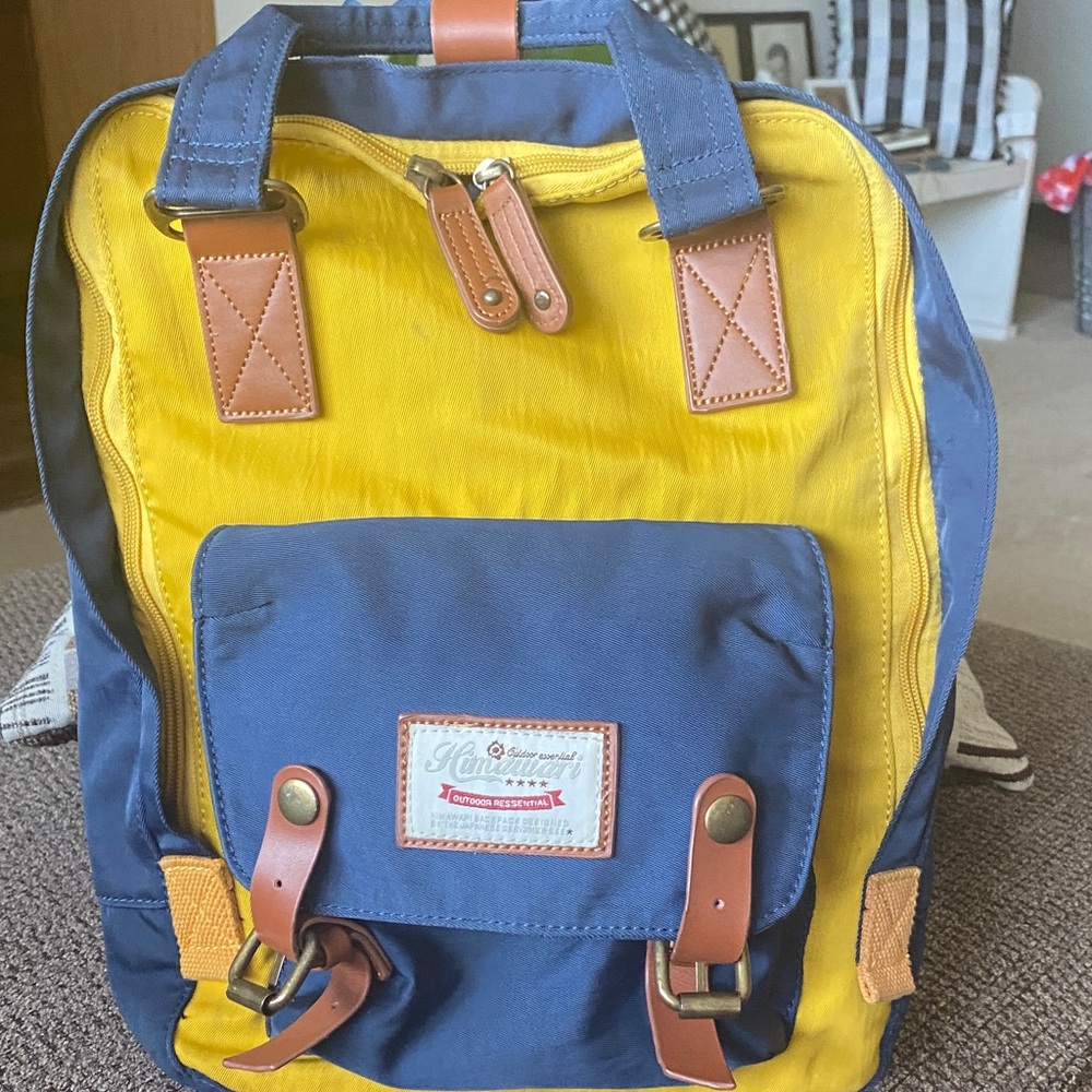 Chic Blue and Yellow Backpack with Leather Accents